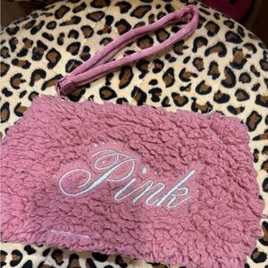 Pink fuzzy wristlet